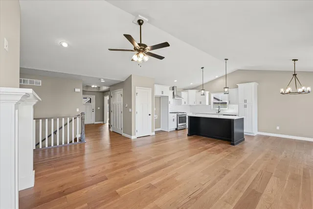 a view of a kitchen with a sink and a window