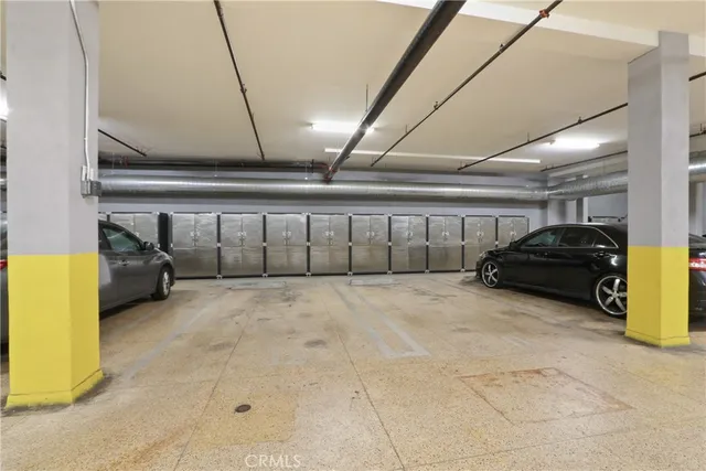 a view of parking garage with cars