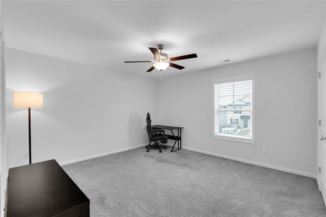 215 Royal Way Pendleton, SC 29670 - Photo 20 of 33 This spacious room offers comfort and versatility with ample natural light.