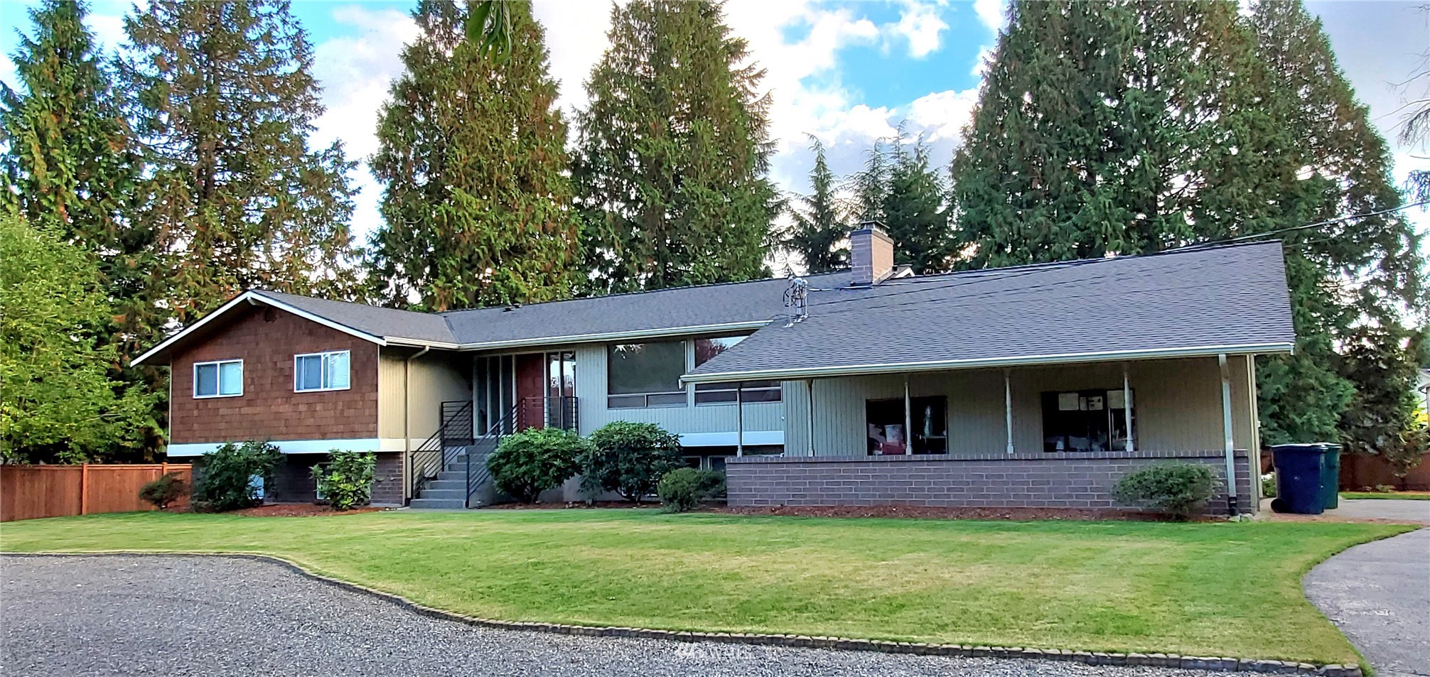 15927 35th Avenue Southeast Bothell, WA 98012 - Photo 1 of 35 a front view of a house with a garden