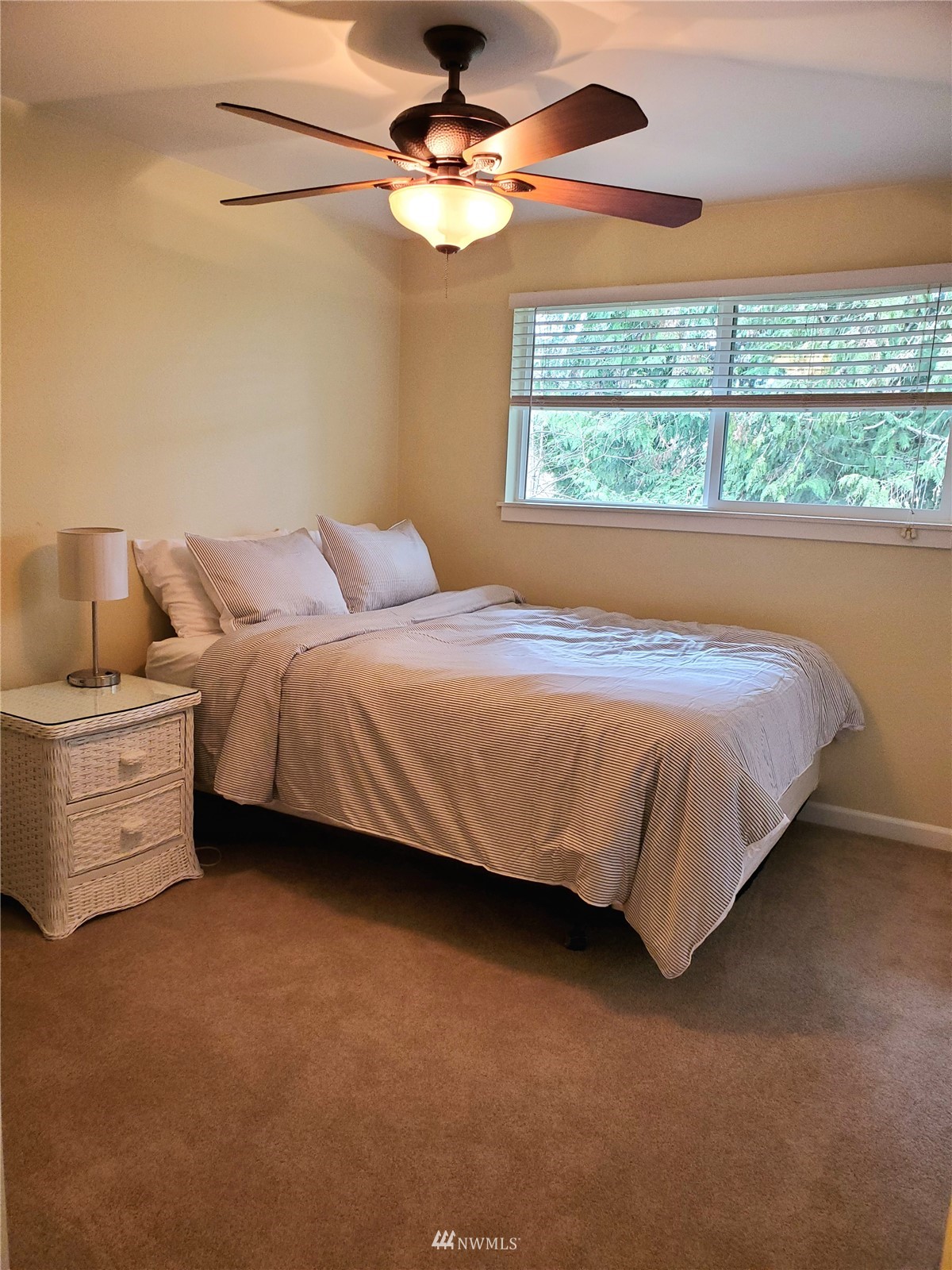 15927 35th Avenue Southeast Bothell, WA 98012 - Photo 18 of 35 a bedroom with a bed dresser and a window