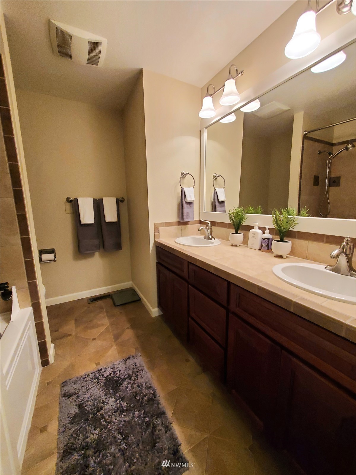 15927 35th Avenue Southeast Bothell, WA 98012 - Photo 35 of 35 a bathroom with a sink and a mirror