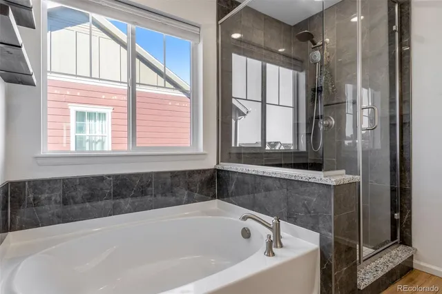 a bathroom with a granite countertop sink a toilet and a mirror