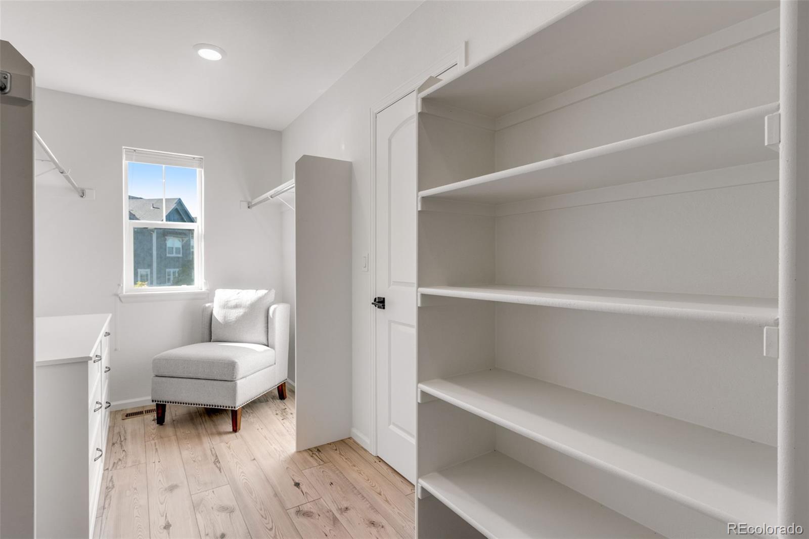 306 Rodden Drive Erie, CO 80516 - Photo 20 of 49 a living room with a couch and a window