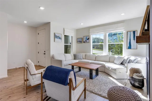 a living room with furniture and a window
