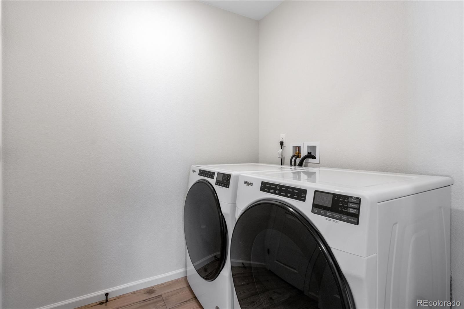 306 Rodden Drive Erie, CO 80516 - Photo 28 of 49 a utility room with dryer and washer