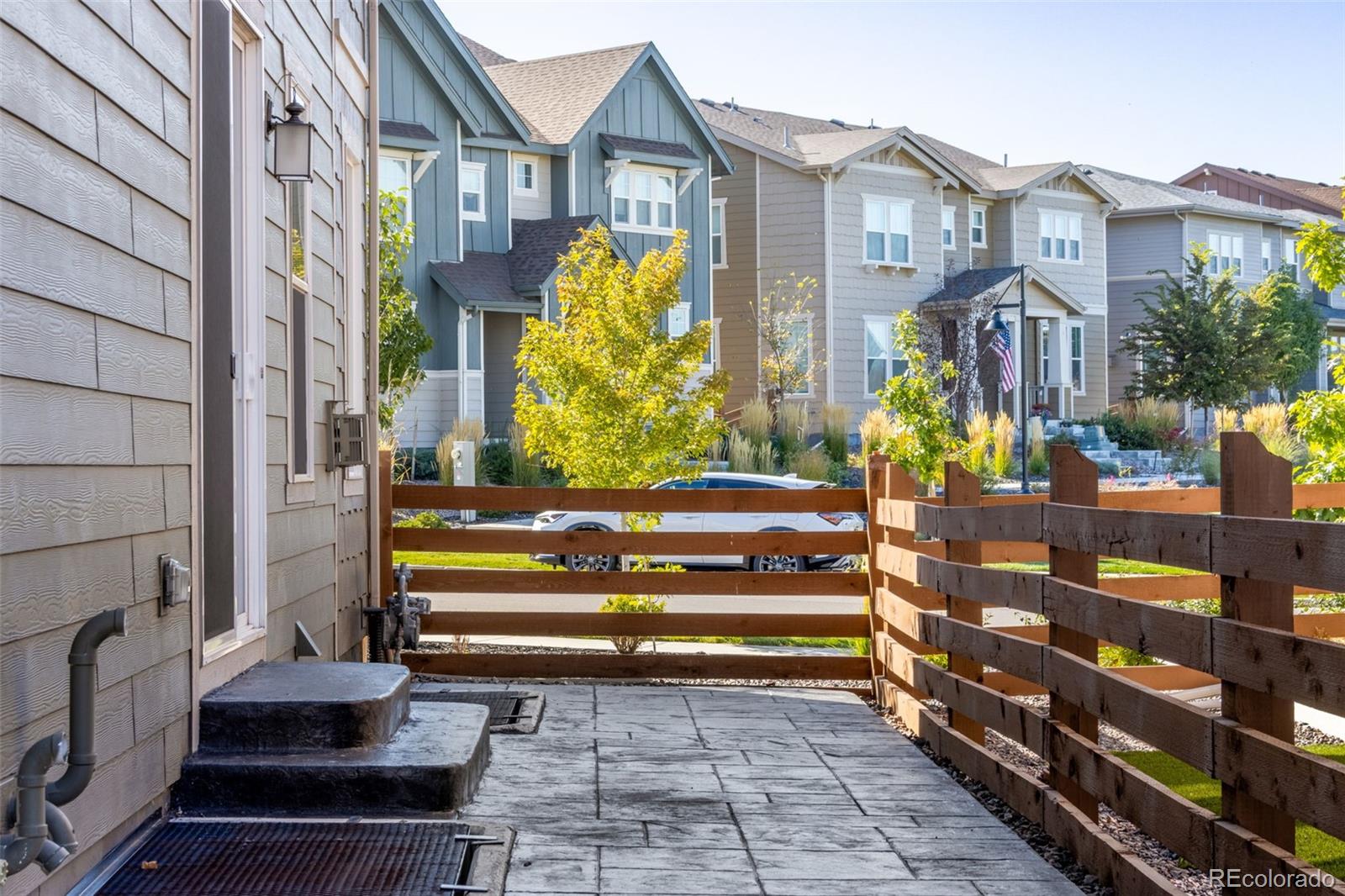 306 Rodden Drive Erie, CO 80516 - Photo 30 of 49 a view of building with a garden and pathway