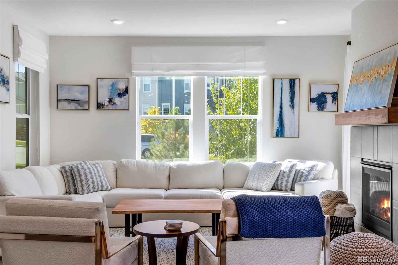 306 Rodden Drive Erie, CO 80516 - Photo 4 of 49 a living room with furniture and a large window