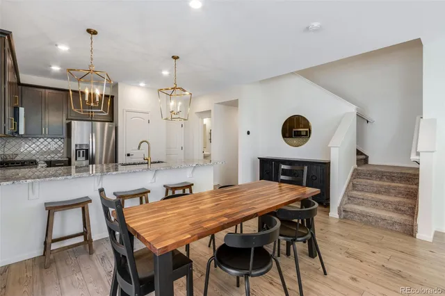 a kitchen with a table and chairs in it
