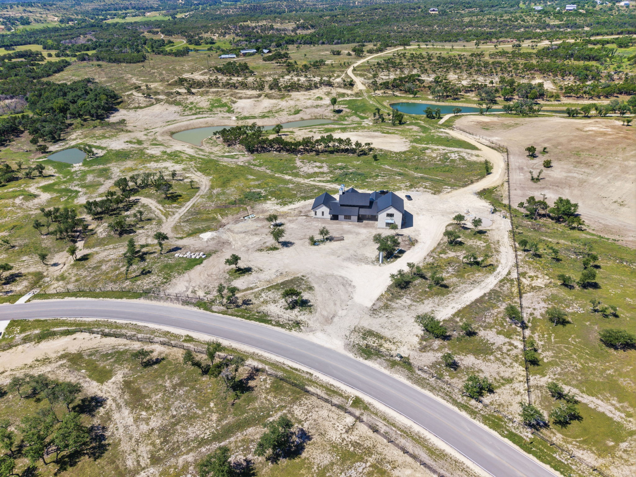 3300 Rm-165 Dripping Springs Dripping Springs, TX 78620 - Photo 5 of 25 a view of a lake with a mountain