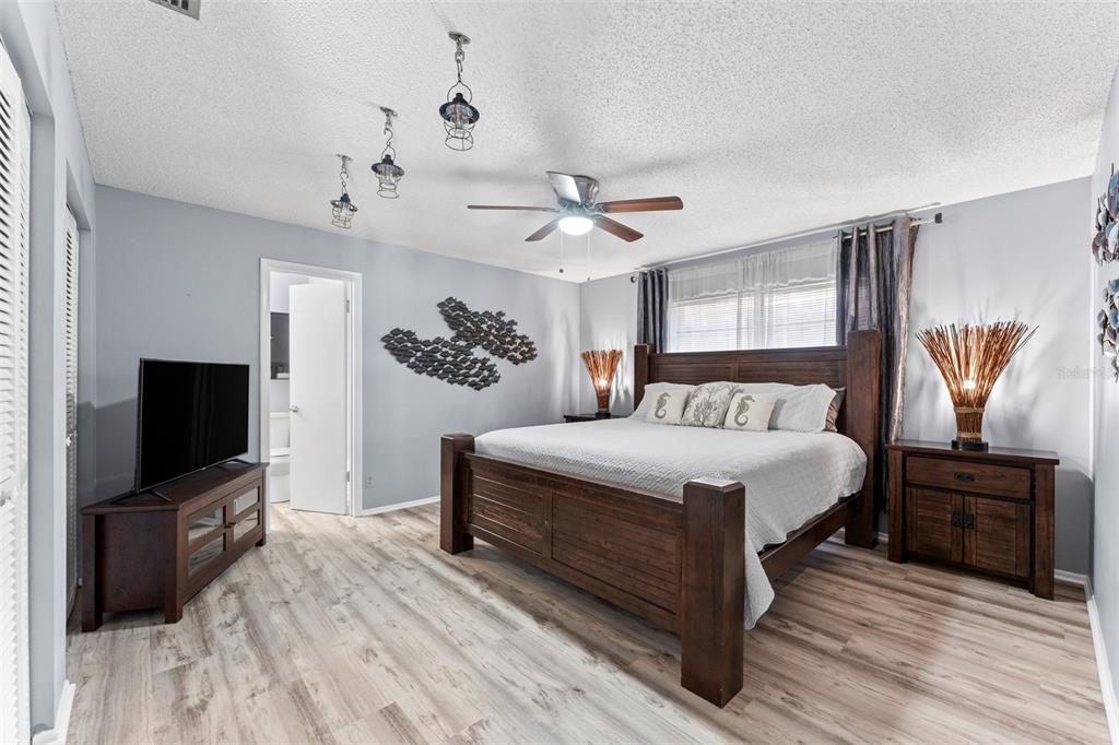 29 Pelican Lane Edgewater, FL 32141 - Photo 17 of 39 a bedroom with a bed and a flat screen tv