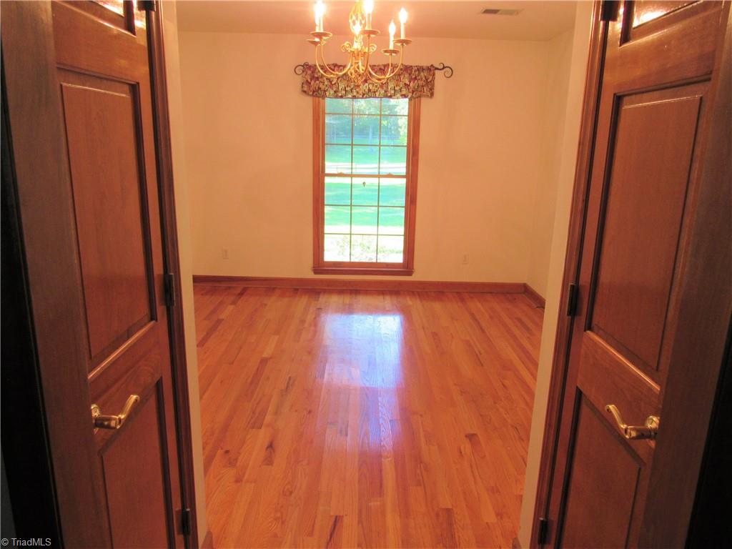 180 Roehm Landing Denton, NC 27239 - Photo 32 of 35 The dining room also has hardwoods.