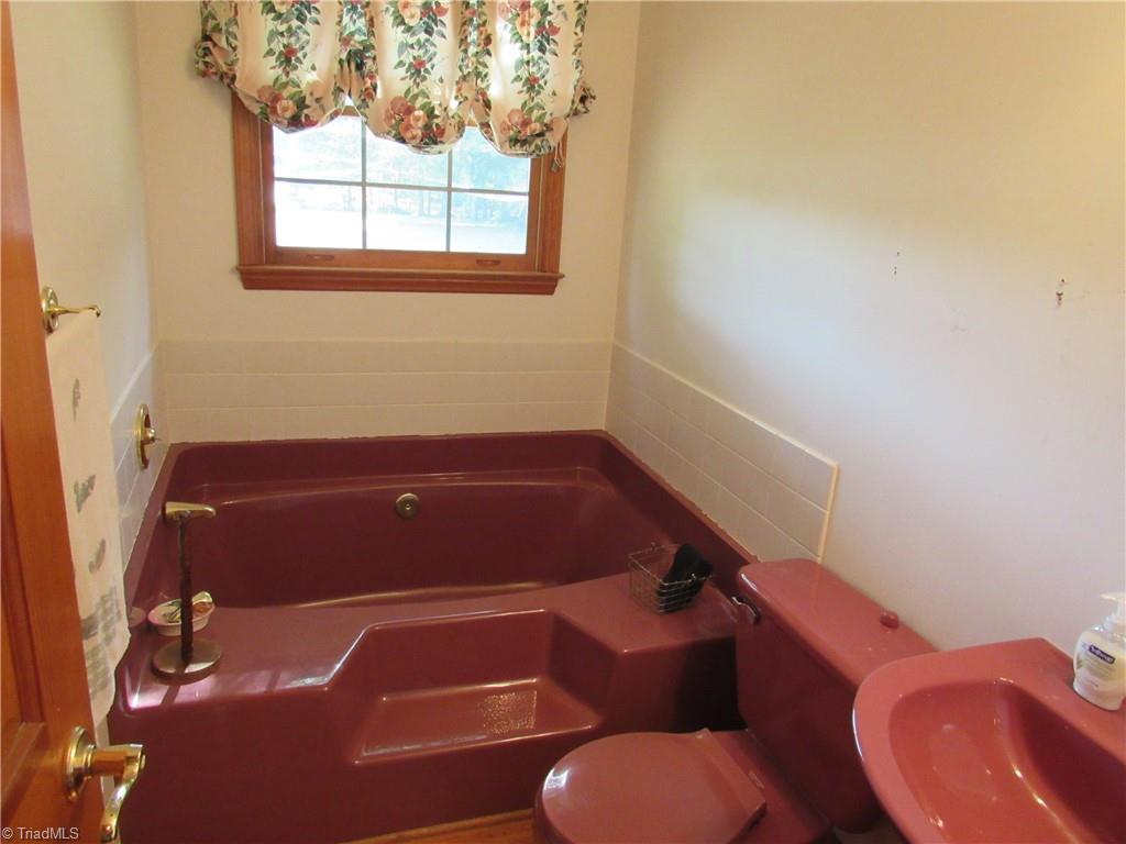 180 Roehm Landing Denton, NC 27239 - Photo 35 of 35 The laundry has a sink and cabinets over where the washer and dryer goes.