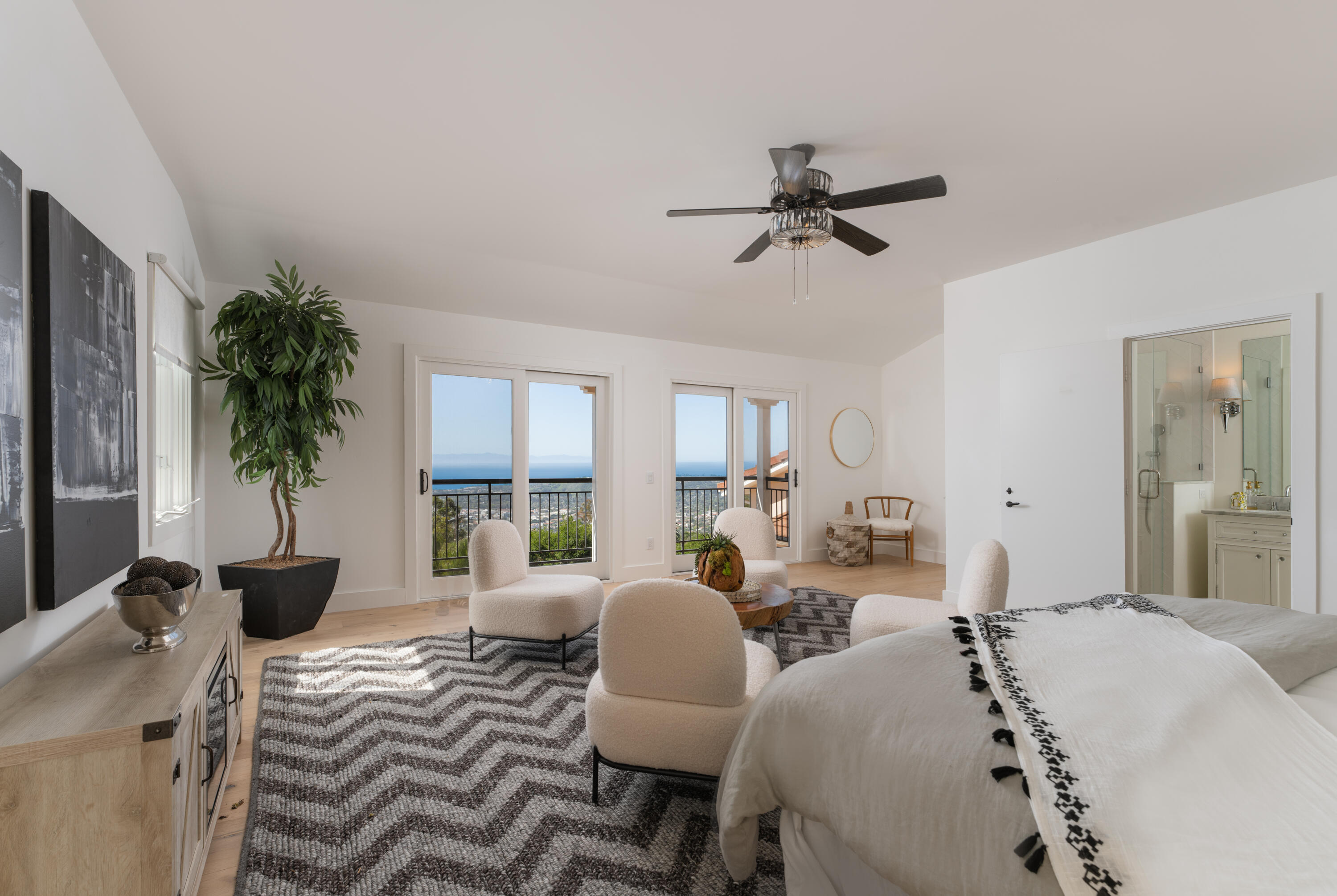 1568 Franceschi Road Santa Barbara, CA 93103 - Photo 11 of 17 a living room with furniture potted plant and a window