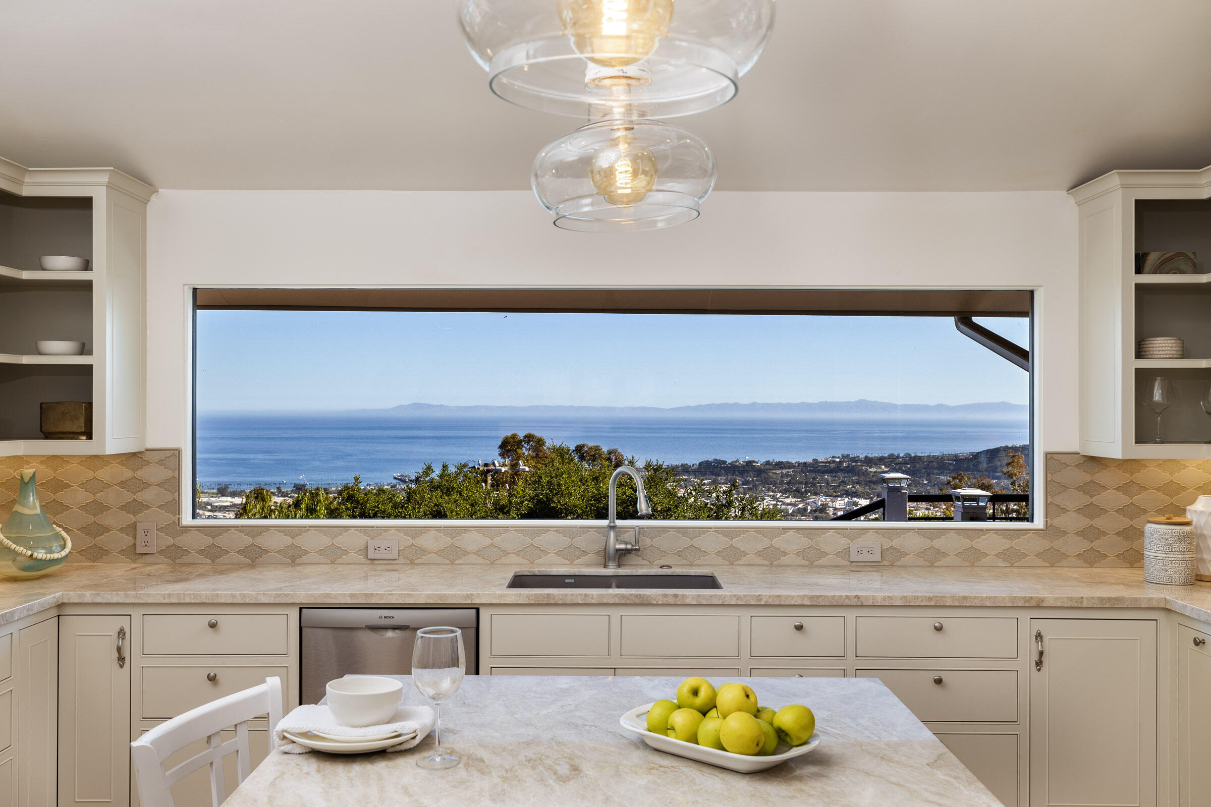1568 Franceschi Road Santa Barbara, CA 93103 - Photo 3 of 17 a living room with a large window and chandelier