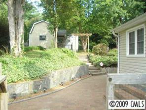6109 Trotters Ridge Road Charlotte, NC 28227 - Photo 5 of 6 a front view of a house with a yard