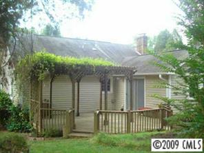 6109 Trotters Ridge Road Charlotte, NC 28227 - Photo 6 of 6 a view of a house with a yard and potted plants