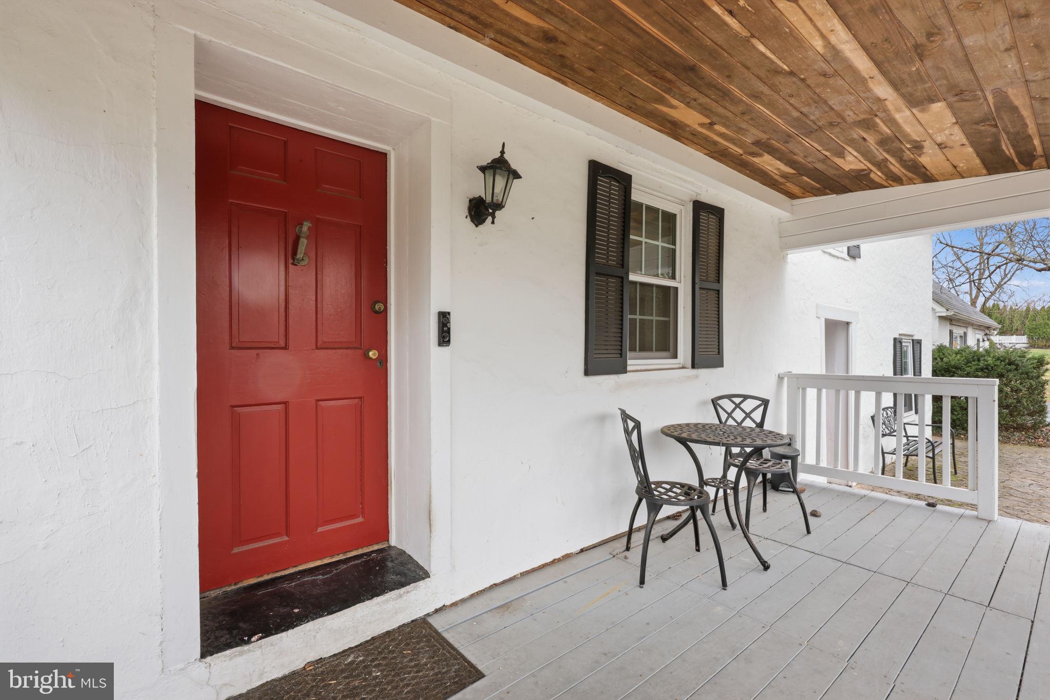 2293 Meetinghouse Road Jamison, PA 18929 - Photo 3 of 47 a view of a porch with a table and chairs