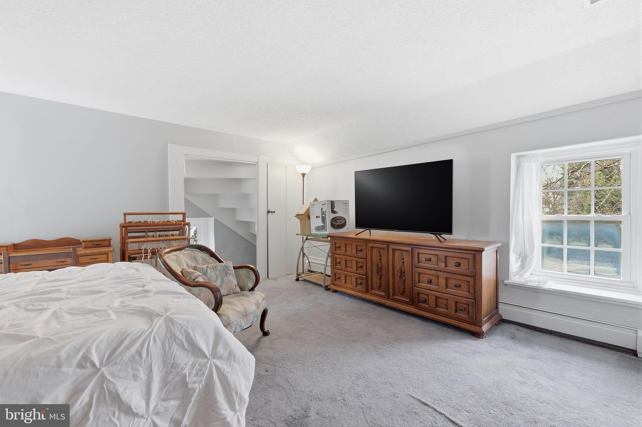 2293 Meetinghouse Road Jamison, PA 18929 - Photo 37 of 47 a bedroom with furniture and a flat screen tv