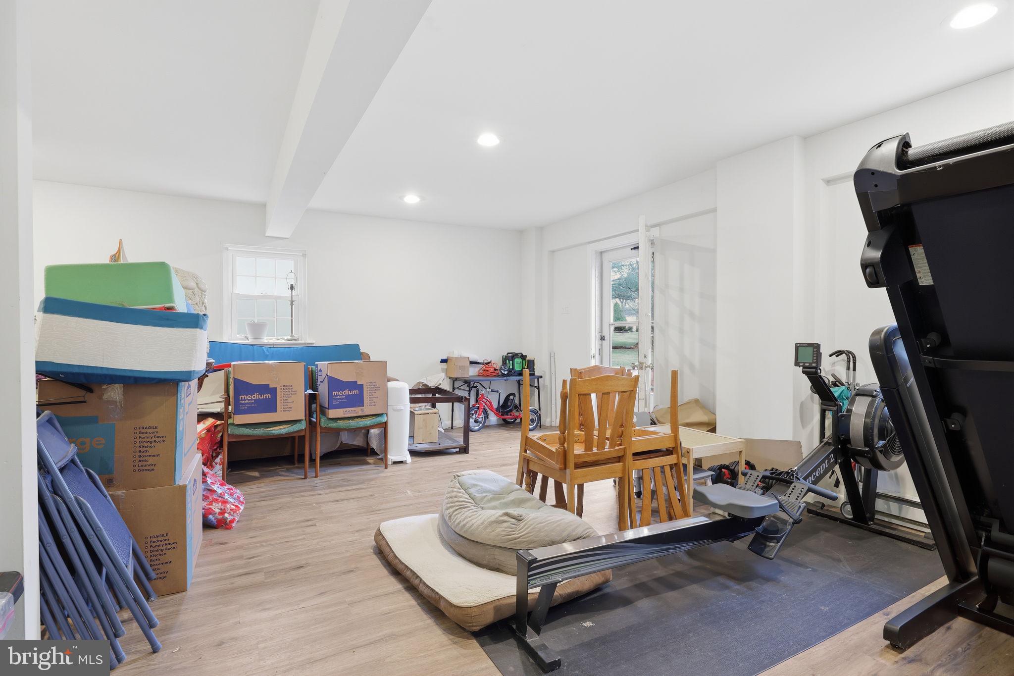 2293 Meetinghouse Road Jamison, PA 18929 - Photo 42 of 47 a living room with furniture a flat screen tv and a wooden floor