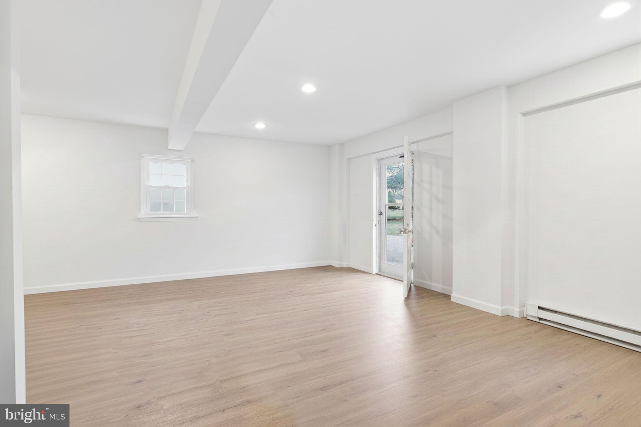 2293 Meetinghouse Road Jamison, PA 18929 - Photo 46 of 47 an empty room with wooden floor and windows