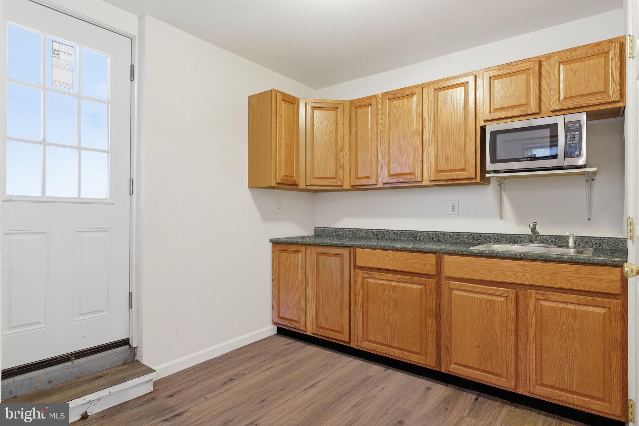 2293 Meetinghouse Road Jamison, PA 18929 - Photo 47 of 47 a kitchen with stainless steel appliances granite countertop a stove a sink and a microwave