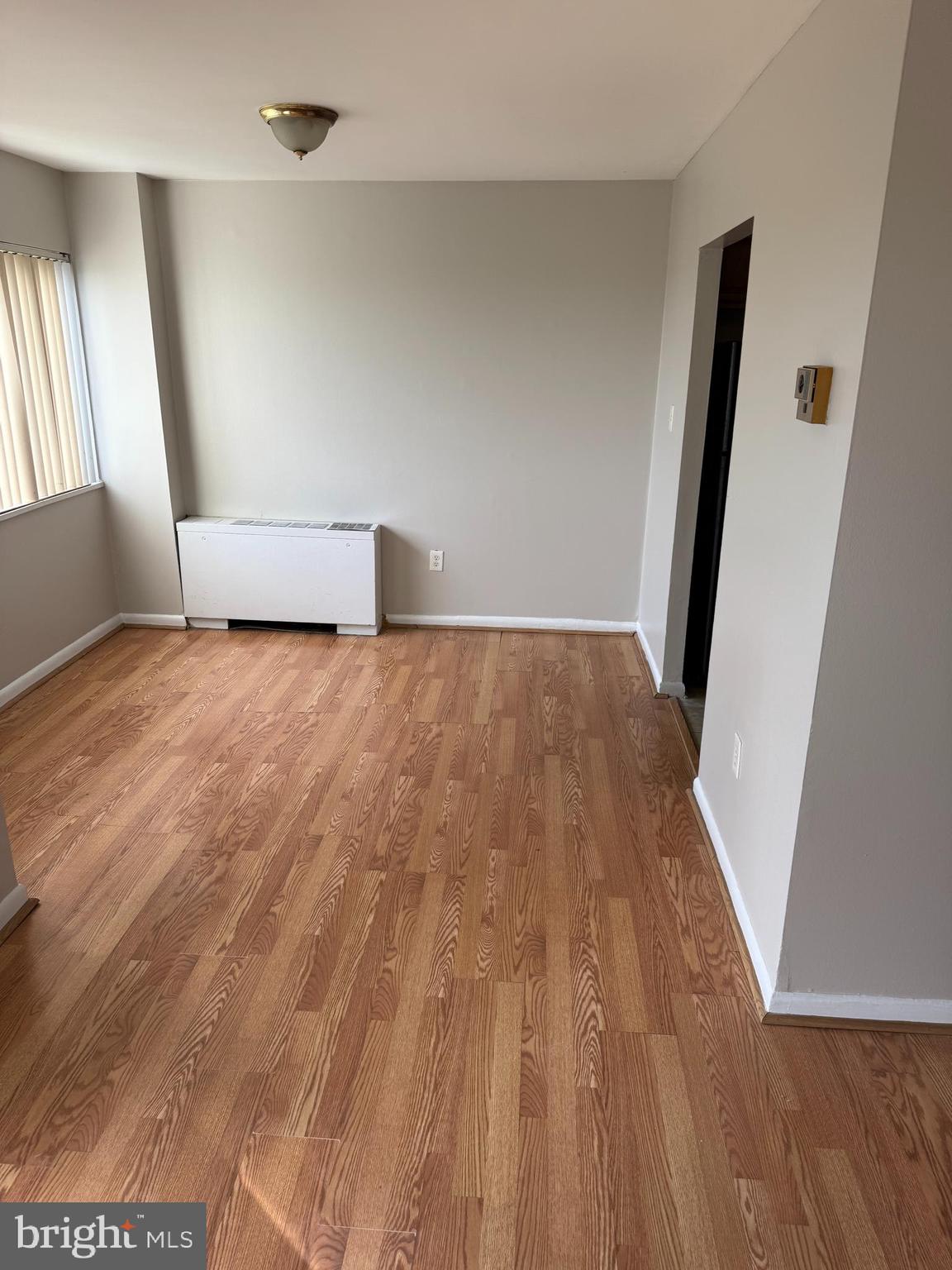 8830 Piney Branch Road Silver Spring, MD 20903 - Photo 15 of 15 an empty room with wooden floor and windows