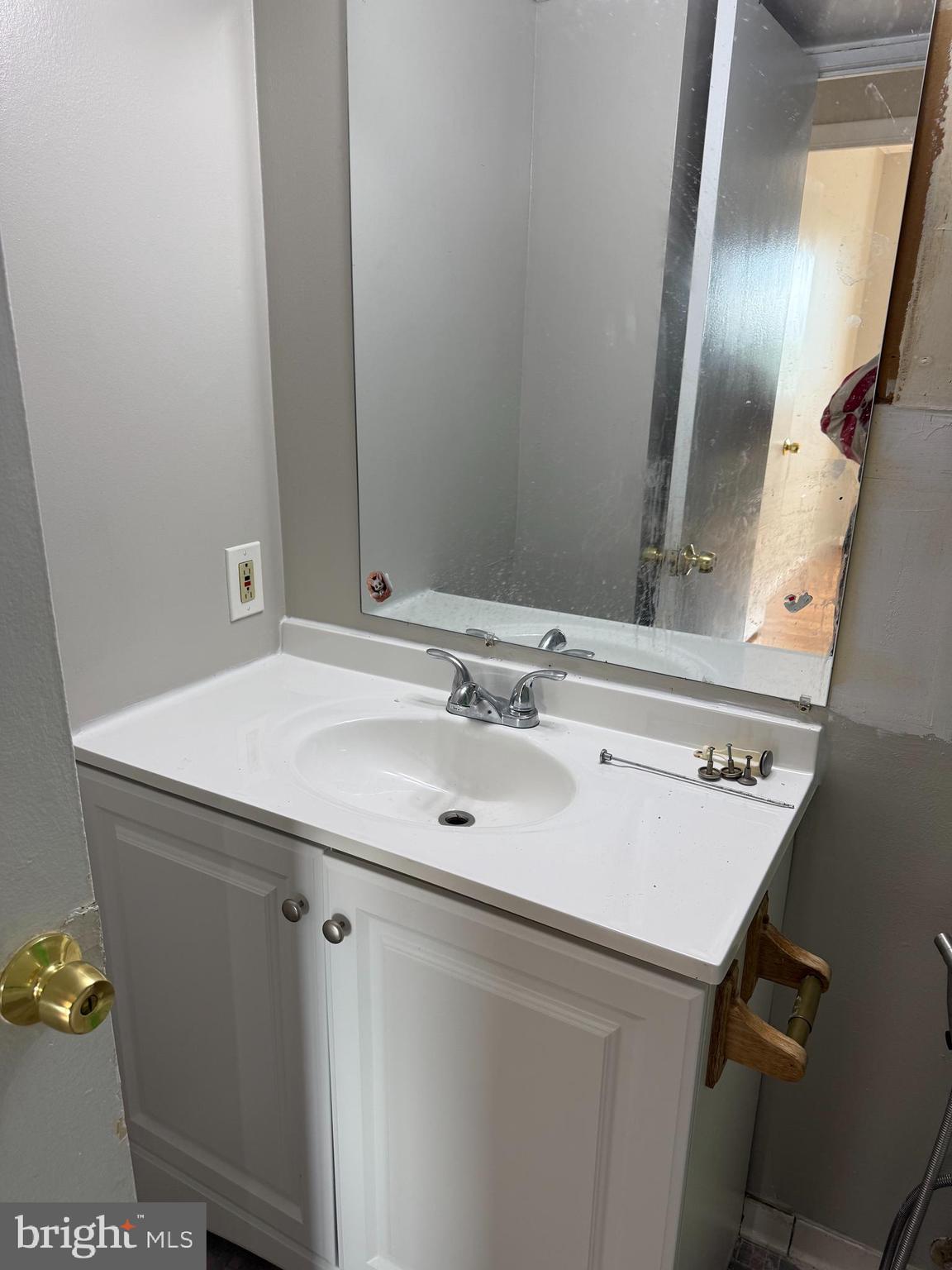 8830 Piney Branch Road Silver Spring, MD 20903 - Photo 6 of 15 a bathroom with a sink and a mirror
