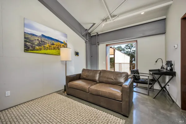a living room with fireplace furniture and a flat screen tv