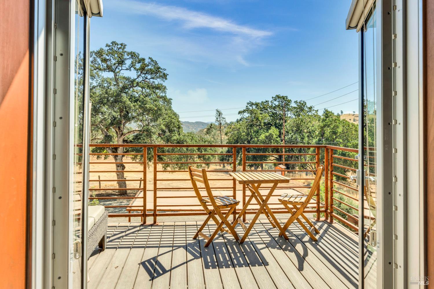 500 Old Long Valley Road Clearlake Oaks, CA 95423 - Photo 19 of 83 a view of a balcony with wooden floor and bench