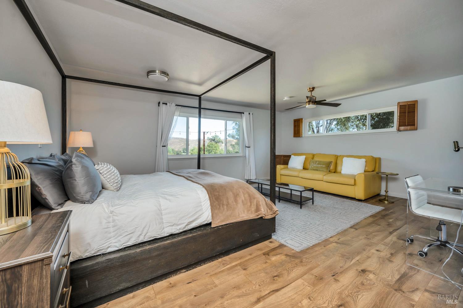 500 Old Long Valley Road Clearlake Oaks, CA 95423 - Photo 46 of 83 a bedroom with a bed and wooden floor