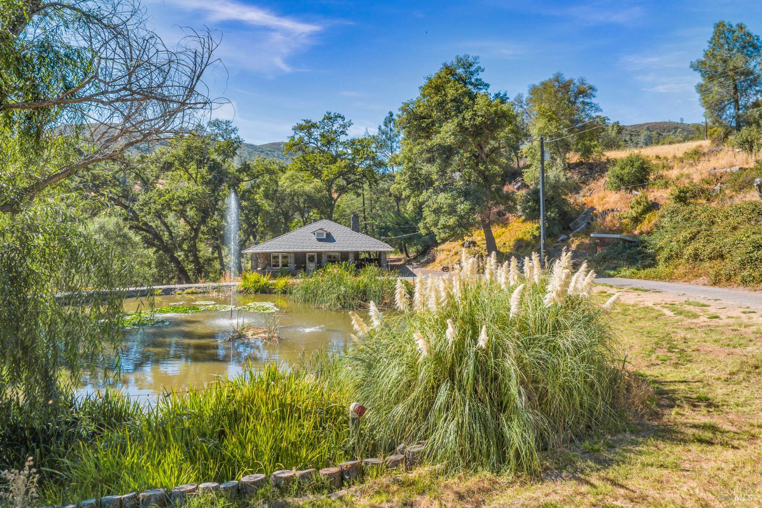 500 Old Long Valley Road Clearlake Oaks, CA 95423 - Photo 70 of 83 a view of a lake with a yard