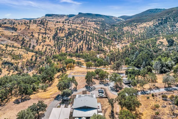 a living room with furniture a rug and a table