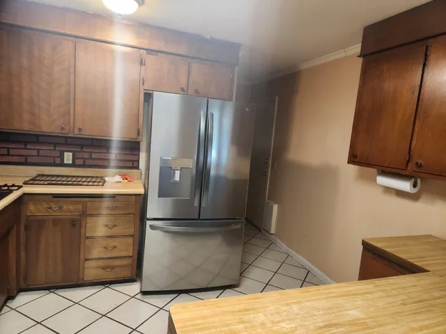 a kitchen with appliances and cabinets