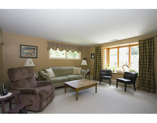 26 Tomahawk Road Arlington, MA 02474 - Photo 15 of 30 a living room with furniture and a large window