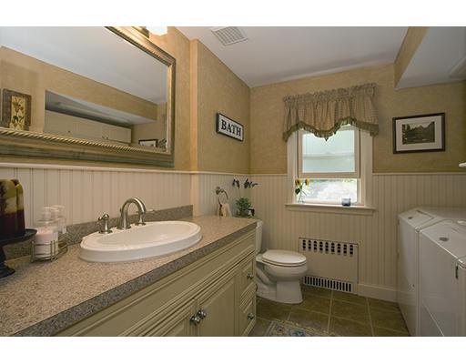 26 Tomahawk Road Arlington, MA 02474 - Photo 16 of 30 a bathroom with a sink vanity mirror and toilet