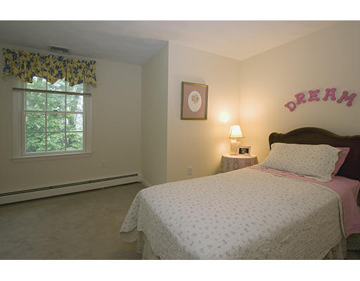26 Tomahawk Road Arlington, MA 02474 - Photo 21 of 30 a bedroom with a bed and a window