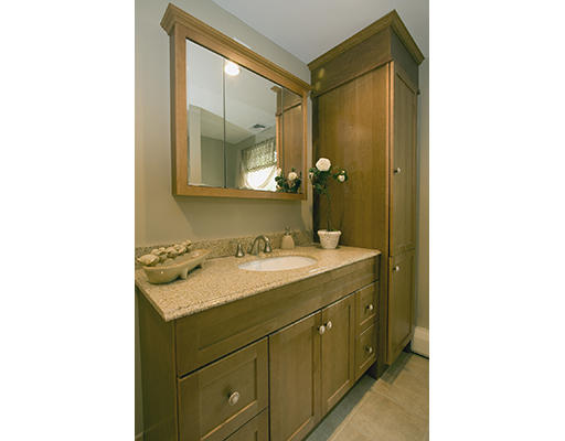 26 Tomahawk Road Arlington, MA 02474 - Photo 24 of 30 a bathroom with a sink and a mirror