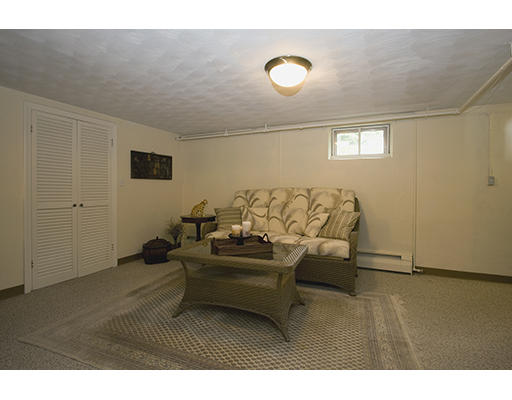 26 Tomahawk Road Arlington, MA 02474 - Photo 25 of 30 a living room with furniture and a flat screen tv