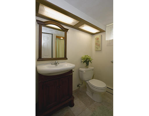 26 Tomahawk Road Arlington, MA 02474 - Photo 27 of 30 a bathroom with a toilet sink and mirror