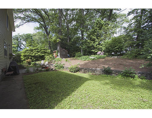 26 Tomahawk Road Arlington, MA 02474 - Photo 30 of 30 a backyard of a house with lots of green space