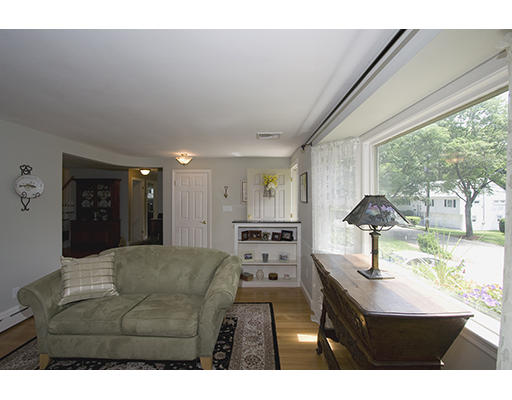 26 Tomahawk Road Arlington, MA 02474 - Photo 4 of 30 a living room with furniture and a flat screen tv