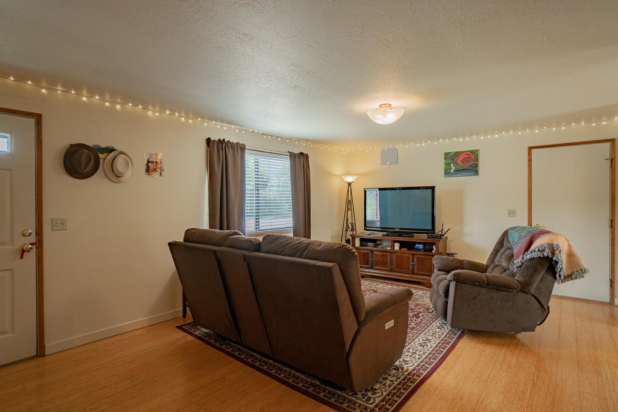 537 Bell Road Talent, OR 97540 - Photo 4 of 23 a living room with furniture and a flat screen tv