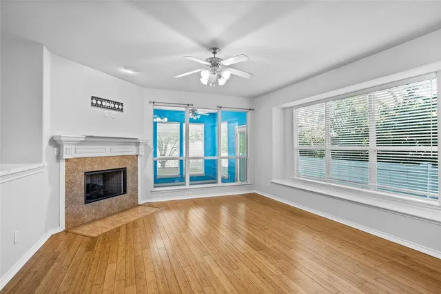 a kitchen with stainless steel appliances granite countertop a stove a sink a microwave and a refrigerator