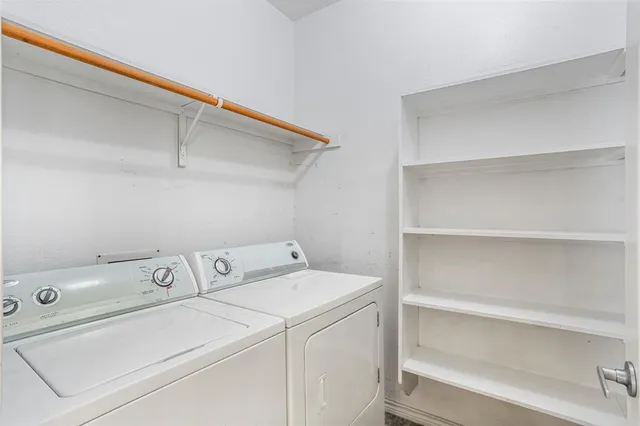 a view of a backyard with large trees