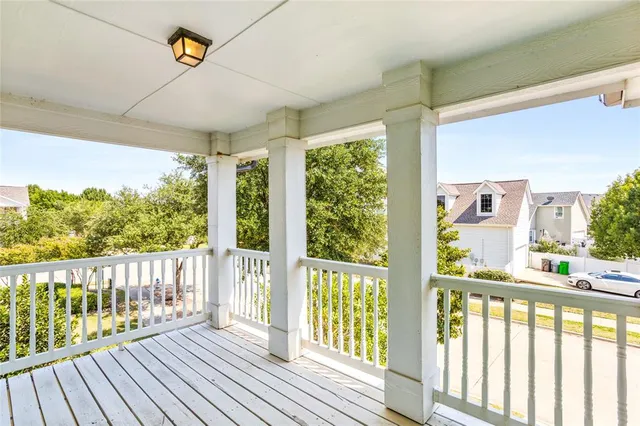 a view of a porch with wooden floor and outdoor space