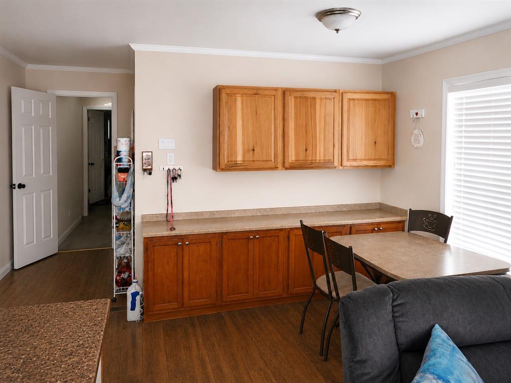 2900 Interstate 35, Unit 80 Waco, TX 76706 - Photo 3 of 10 a kitchen with a sink cabinets and wooden floor
