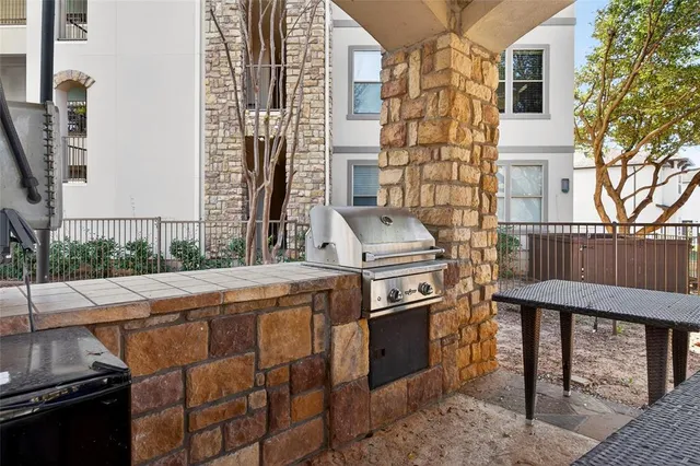 a view of a kitchen with a sink and a stove