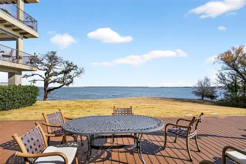 a view of a swimming pool and an outdoor seating