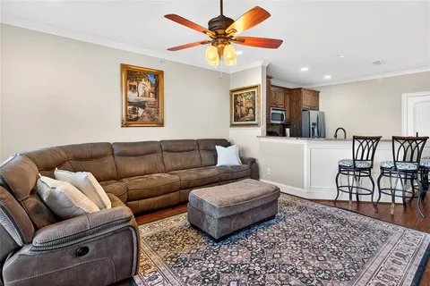 a living room with furniture and a rug